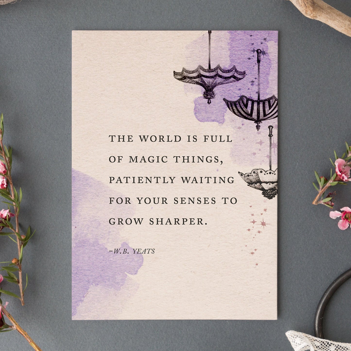 Art print of a Yeats quote that says "The world is full of magic things, patiently waiting for your sense to grow sharper" illustrated with upside umbrellas