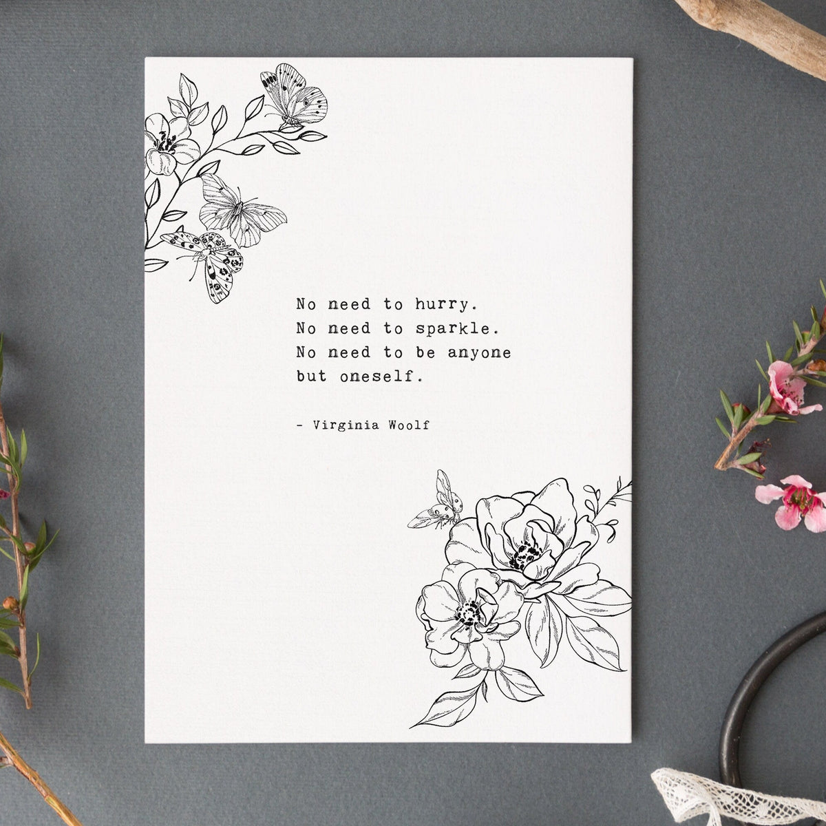 A vertical white art print black floral line art in the top left and bottom right corners, plus a centered quote from Virginia Woolf reading 'No need to hurry. No need to sparkle. No Need to be anyone by oneself