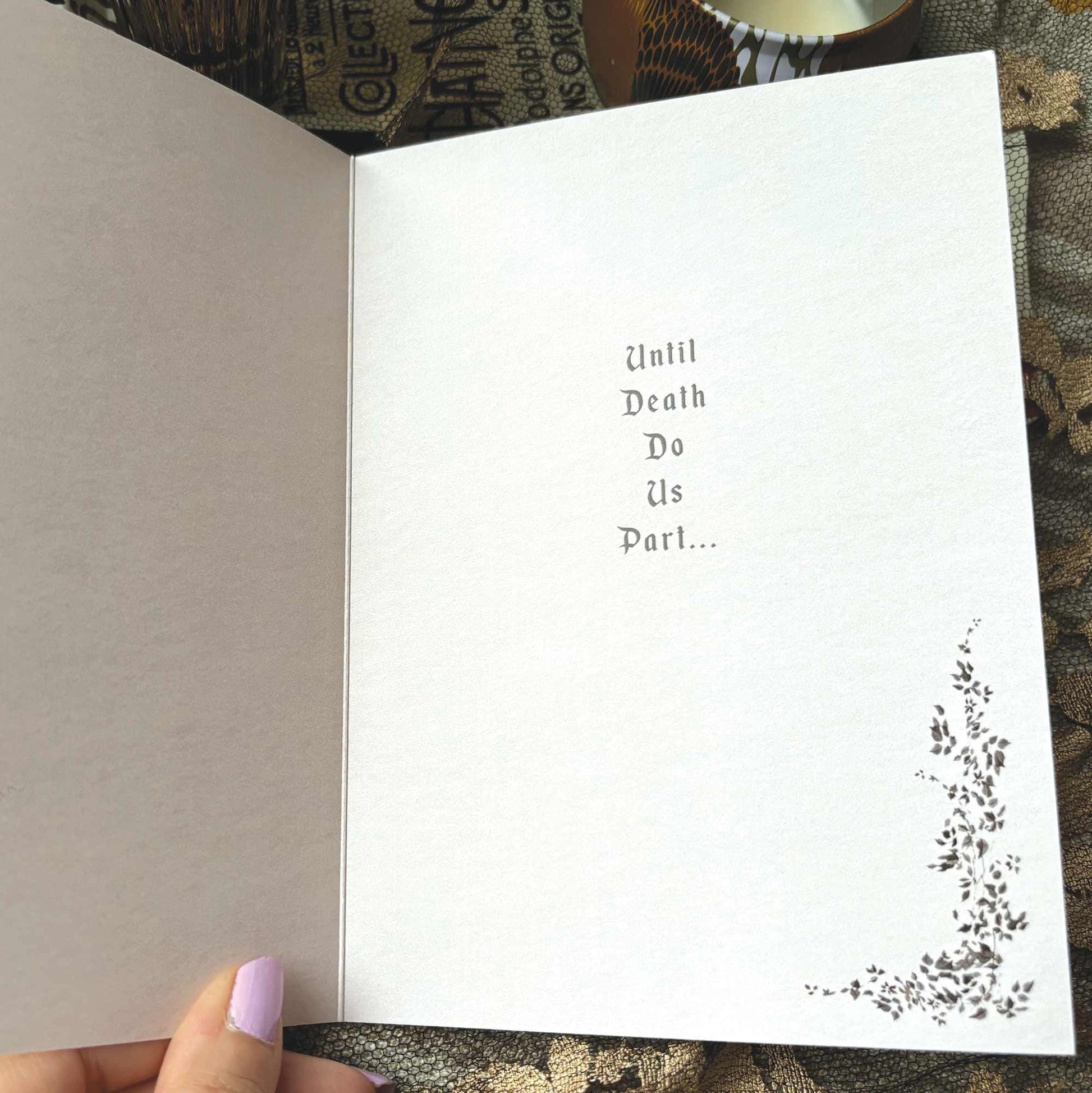 An open white greeting card featuring the printed text 'Until Death Do Us Part.