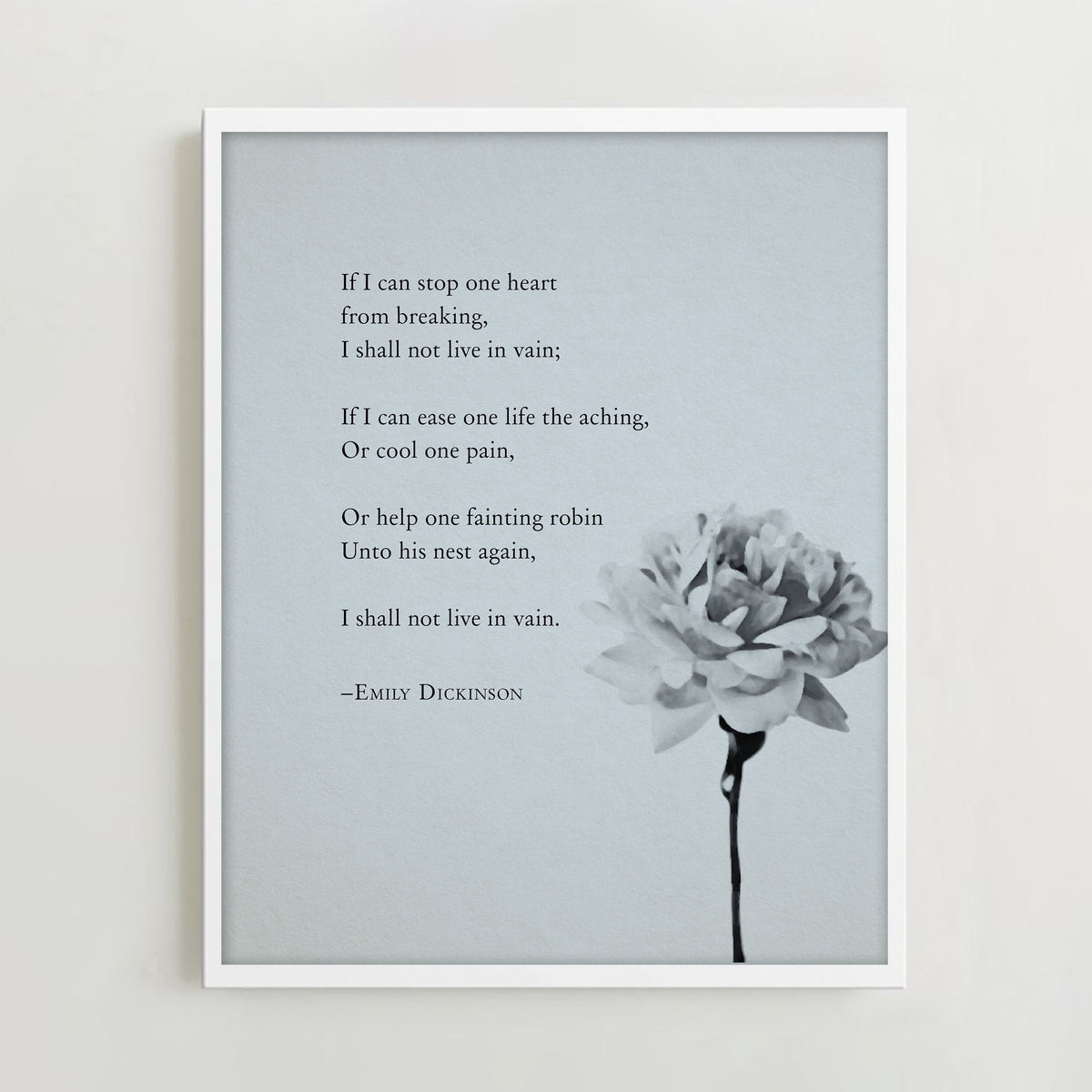 A vertical art print featuring a quote from Emily Dickinson in black text on a light gray background, with a black-and-white flower illustration in the lower right.  The quote is a poem that says "If I can stop one heart from breaking, I shall not live in vain"