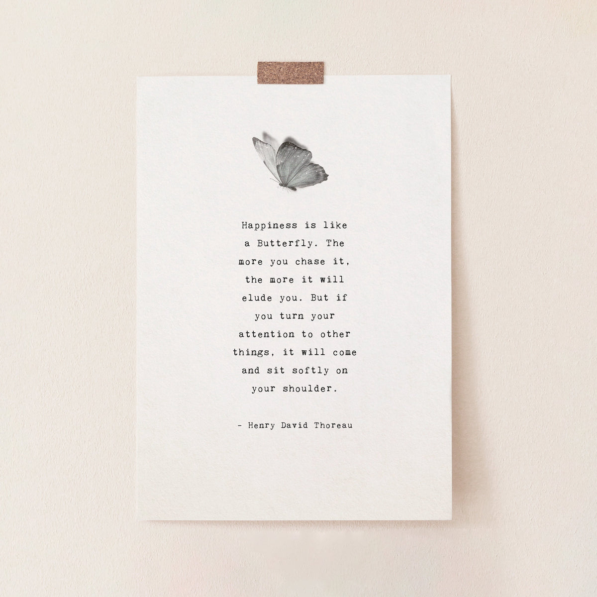 A minimalist art print featuring a black and white butterfly illustration above a typewriter-style quote by Henry David Thoreau. "Happiness is like a butterfly...