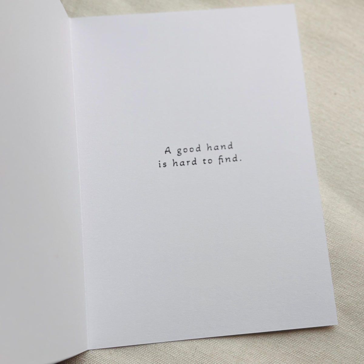 Inside of greeting card that says "a good hand is hard to find"