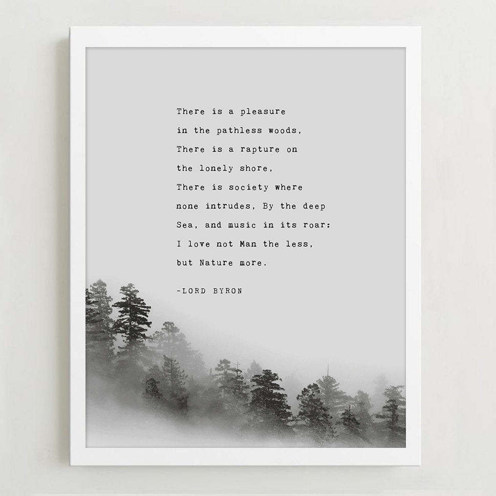 A wall art print featuring a black text quote by Lord Byron over a misty pine forest landscape,.