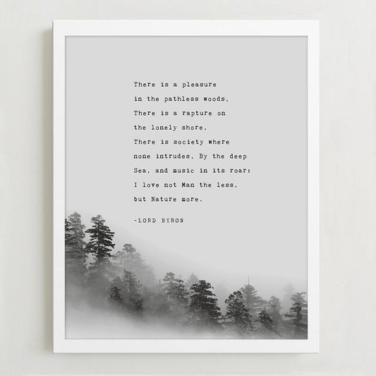 A wall art print featuring a black text quote by Lord Byron over a misty pine forest landscape,.