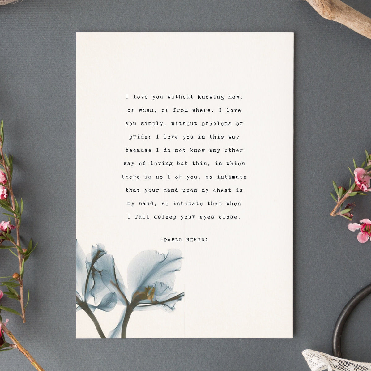 A vertical white art print featuring a quote by Pablo Neruda "I love you without knowing how, or when, or from where." in typewriter font and a blue watercolor floral illustration at the bottom. 