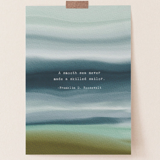 A vertical art print featuring an abstract watercolor seascape in muted teal, blue, and olive tones, with a white typewriter-style quote in the center reading, 'A smooth sea never made a skilled sailor. -Franklin D.