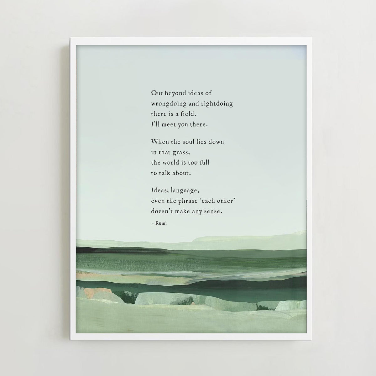 A framed art print featuring a quote by Rumi over a minimalist landscape painting in shades of green and gray with a quote by Rumi that says "out beyond the ideas of wrongdoing and right doing there is a field. I'll meet you there"