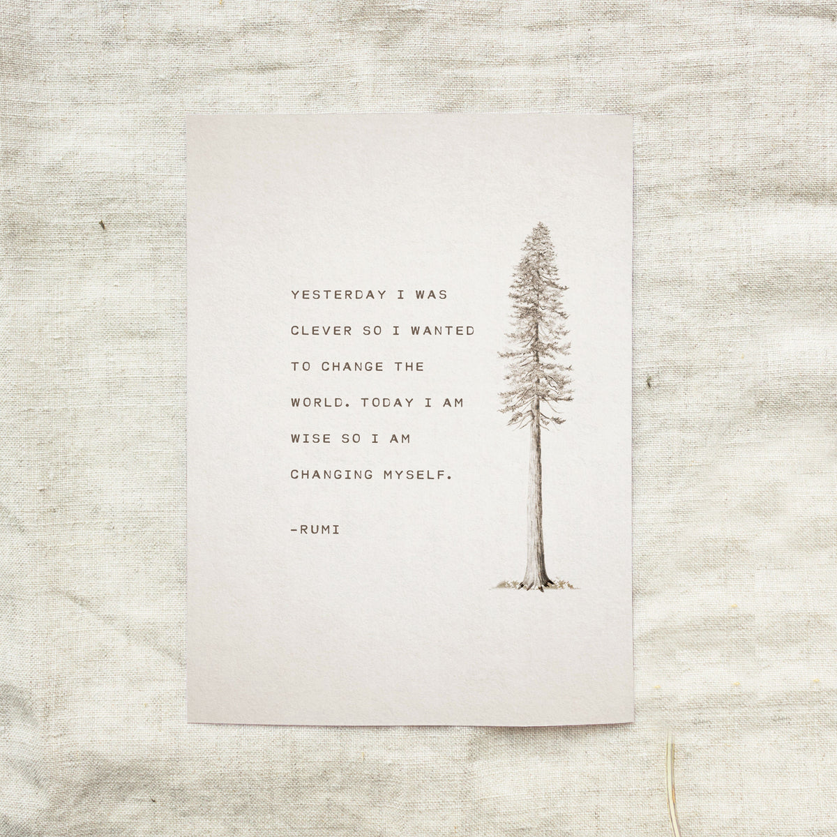 An art print feature an illustration of a pine tree and a quote that says "Yesterday I was clever so I wanted to change the world. Today I am wise so I am changing myself"-Rumi