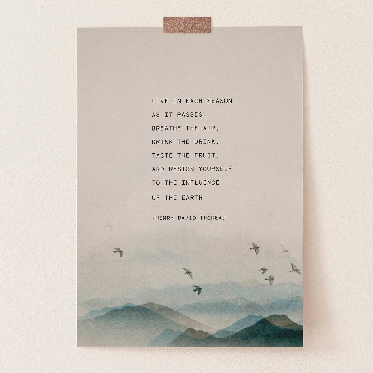 An art print featuring a quote by Henry David Thoreau above a watercolor mountain landscape with flying birds which says "Live in each season as it passes, breathe the air, drink the drink, taste the fruit and resign yourself to the influence of the earth"