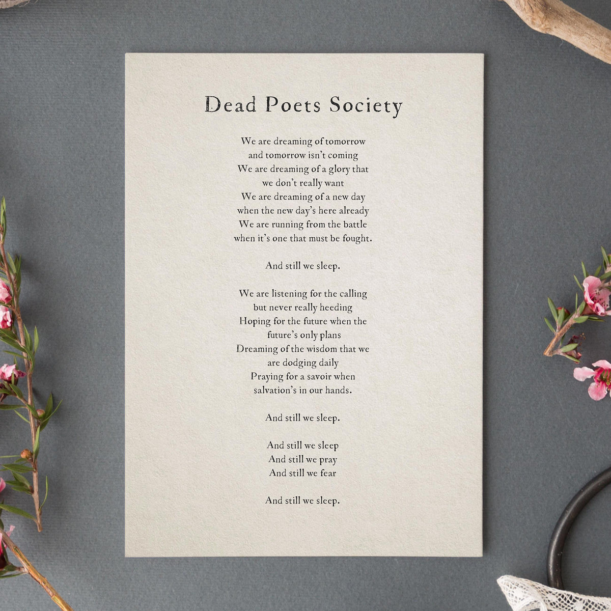 A simple wall art print featuring a quote from the movie 'Dead Poets Society'  that says "we are dreaming of tomorrow and tomorrow isn't coming. We're dreaming of a gloy that we don't really want..."