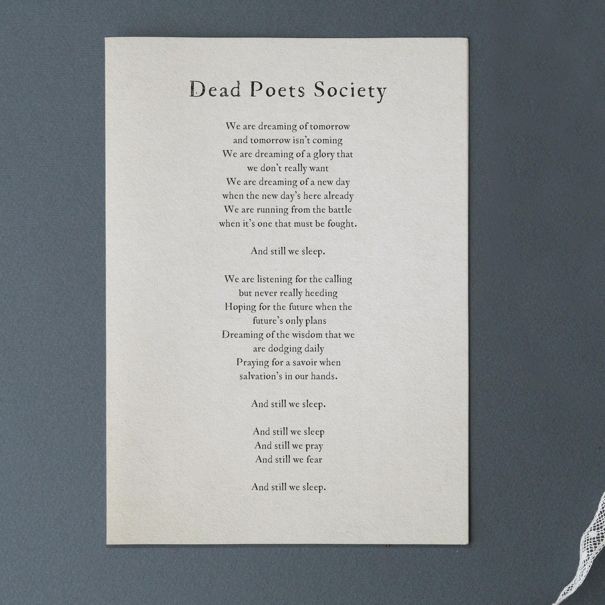 A simple wall art print featuring a quote from the movie 'Dead Poets Society'  that says "we are dreaming of tomorrow and tomorrow isn't coming. We're dreaming of a gloy that we don't really want..."
