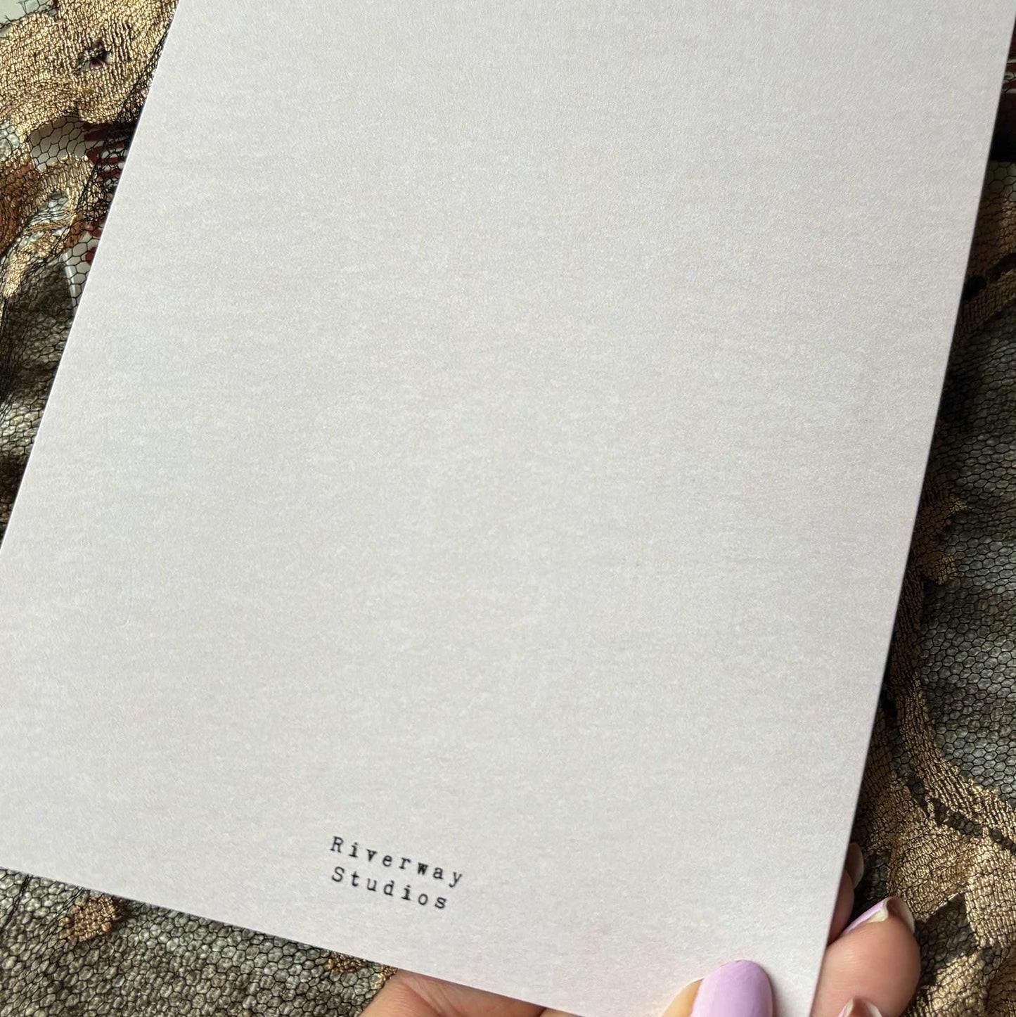 Back of card featuring shop logo