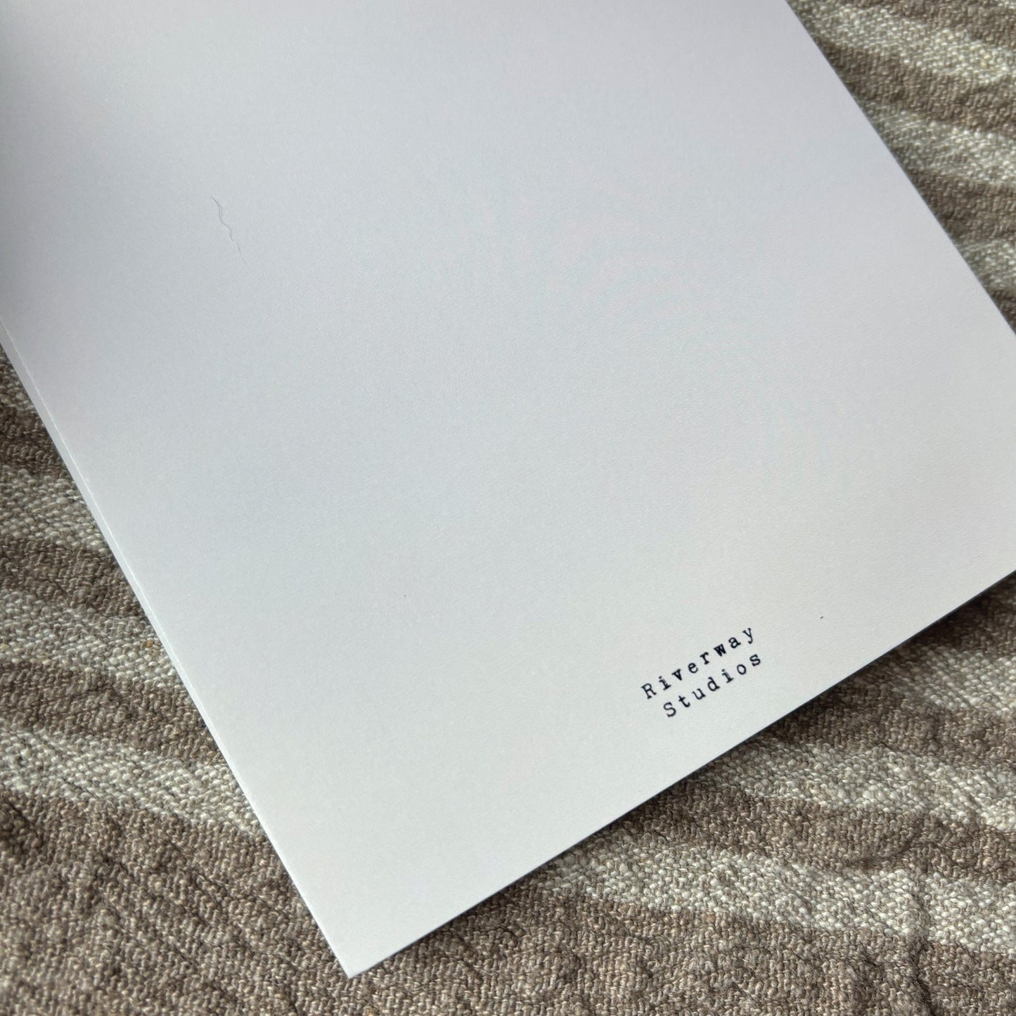 Back of greeting card with shop logo
