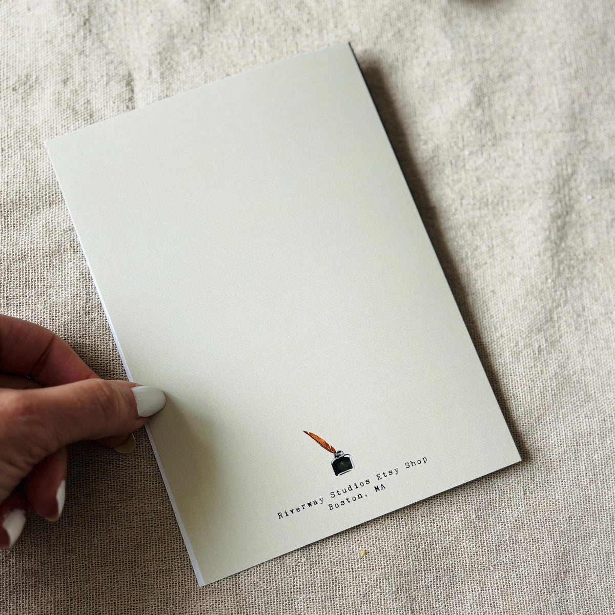 Back of greeting card with shop logo