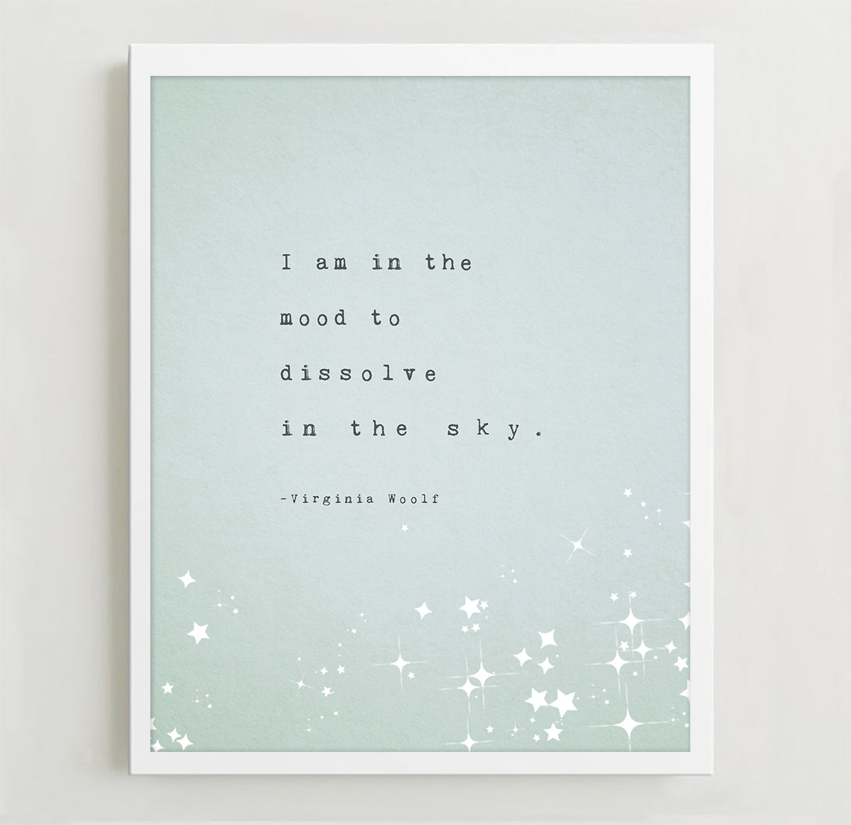 A vertical art print featuring a quote by Virginia Woolf, with the quote "I am in the mood to dissolve in the sky"The print has a pale mint green background with black typewriter-style text and white star illustrations at the bottom.