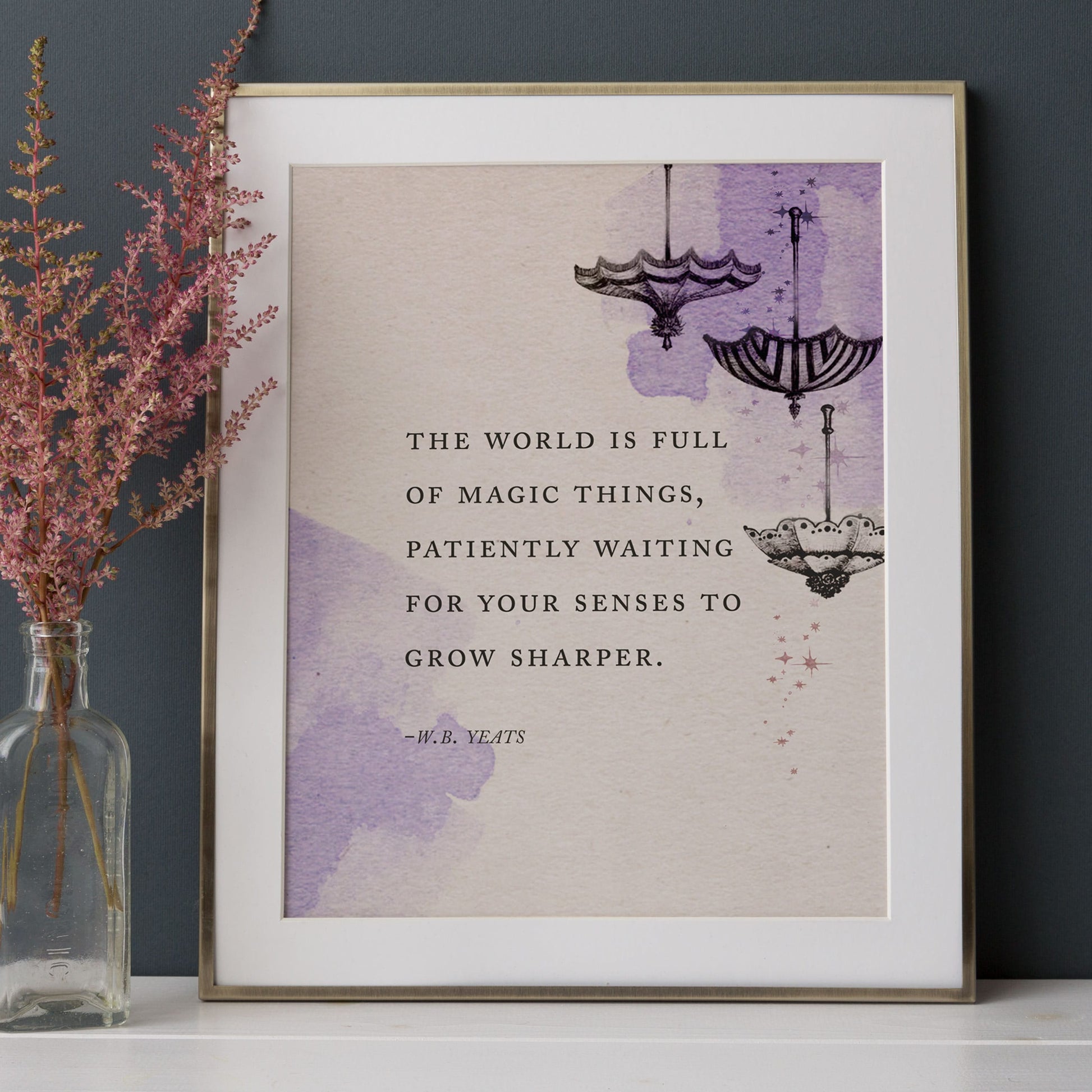 Art print of a Yeats quote that says "The world is full of magic things, patiently waiting for your sense to grow sharper" illustrated with upside umbrellas