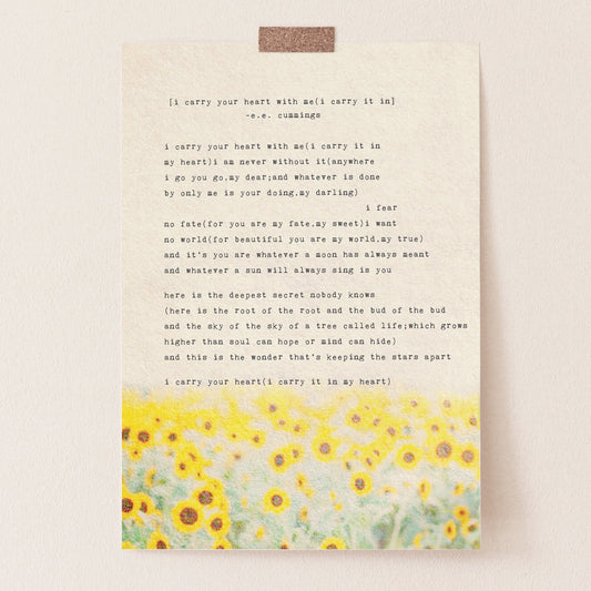 An art print of sunflowers with the poem by e.e. cummings "I carry your heart with me(I carry it in}