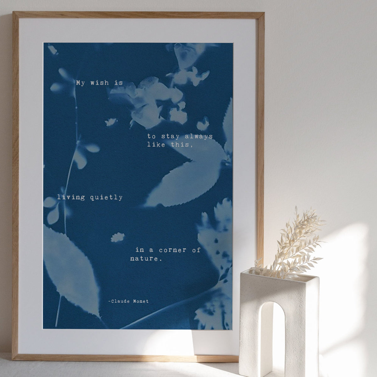 Claude Monet Quote art set on a cyanotype background which says "My wish is to stay always like this, living quietly in a corner of nature"