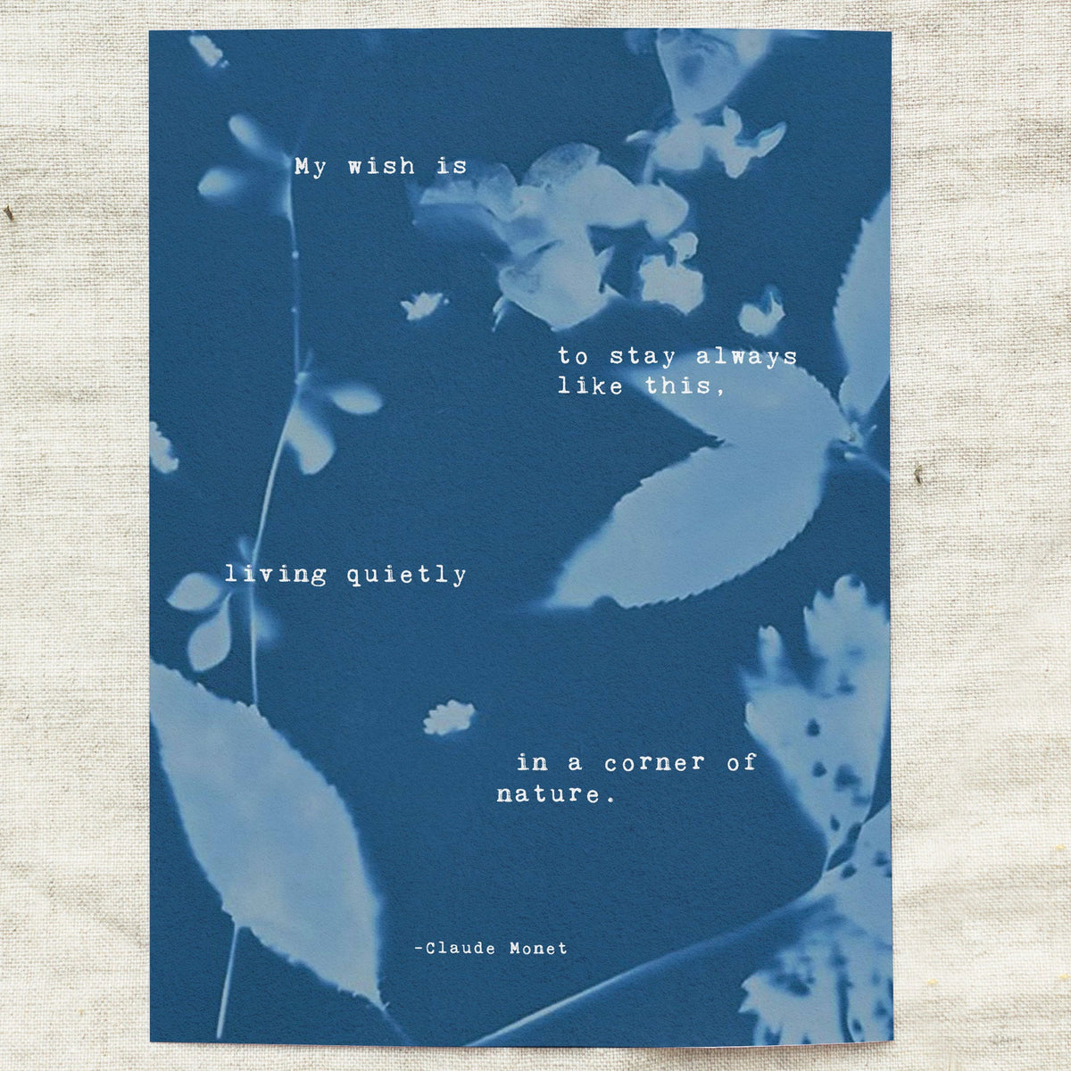 Claude Monet Quote art set on a cyanotype background which says "My wish is to stay always like this, living quietly in a corner of nature"