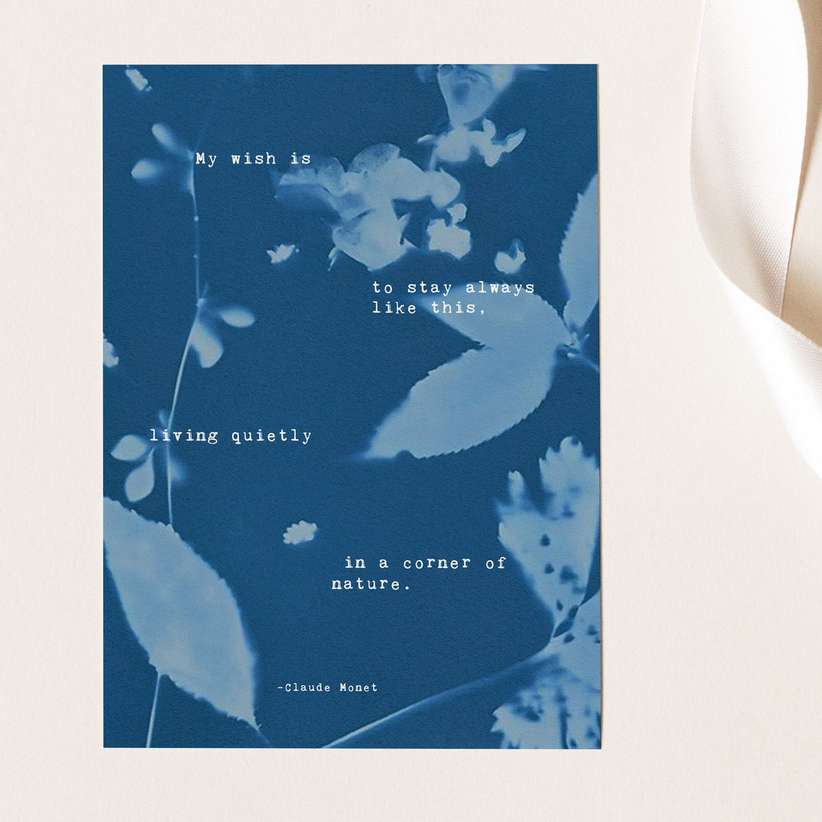 Claude Monet Quote art set on a cyanotype background which says "My wish is to stay always like this, living quietly in a corner of nature"