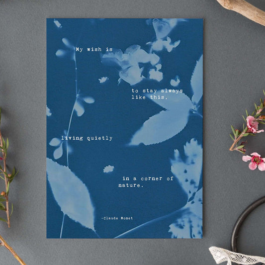 Claude Monet Quote art set on a cyanotype background which says "My wish is to stay always like this, living quietly in a corner of nature"