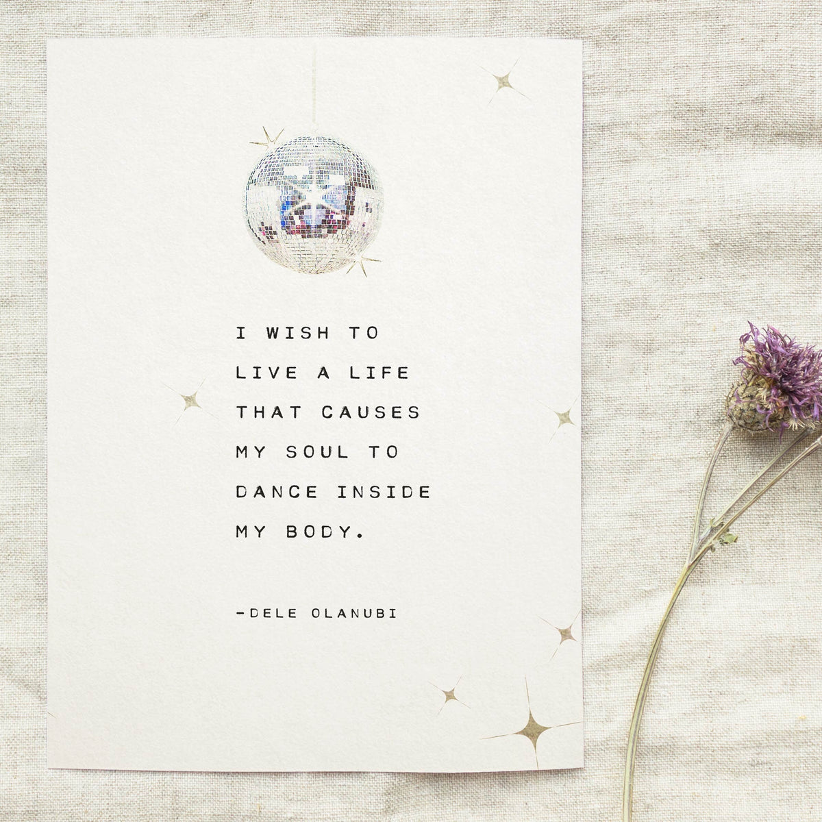 An art print of a shining disco ball that has the quote "I wish to life a life that causes my soul to dance inside my body" by dele olanubi
