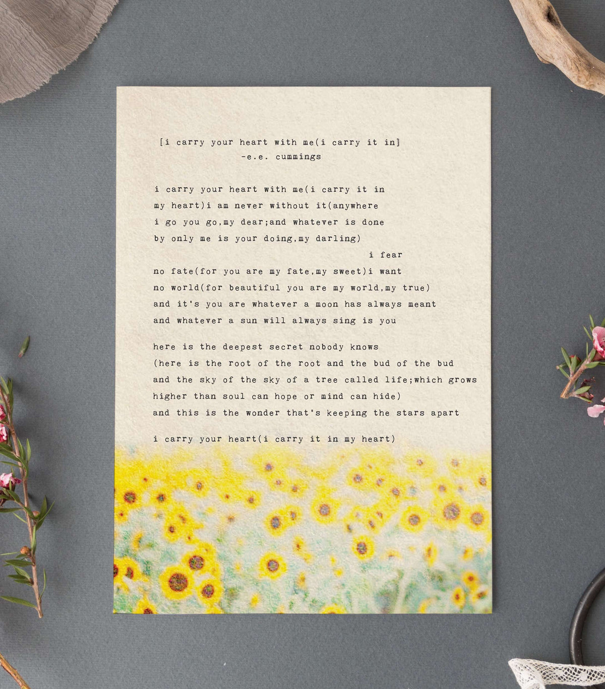 An art print of sunflowers with the poem by e.e. cummings "I carry your heart with me(I carry it in}